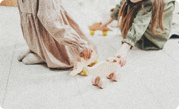 A 90s-style photograph of two girls playing with their toys.